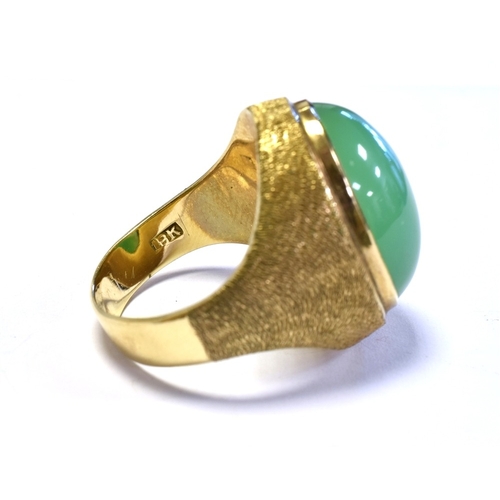 7 - 18CT GOLD & CHRYSOPRASE RING bezel set with a 18.5 x 14.7mm, oval chrysoprase cabochon stone, decora... 