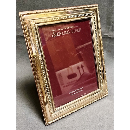 120 - STERLING SILVER PICTURE FRAME 22.3 x 17.3cm overall, with 2.7cm wide embossed silver border, hallmar... 