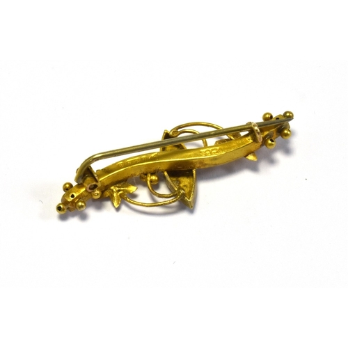 24 - EDWARDIAN 9CT GOLD BAR BROOCH 4.0cm long x 1.5cm wide, set with seed pearl cabochons on a wire pin a... 