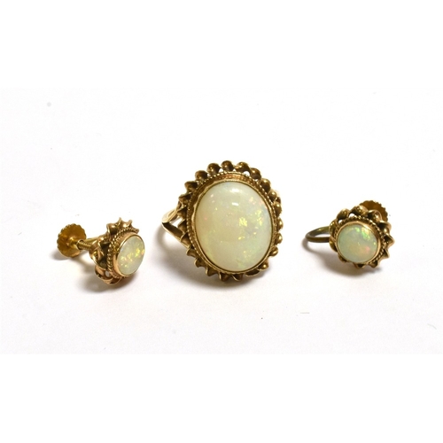 31 - 9CT GOLD WHITE OPAL RING AND EARRINGS ring set with an oval cabochon solid white opal 14.1 x 11.4mm,... 