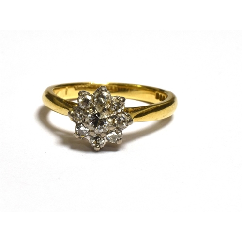 33 - 18CT GOLD & DIAMOND FLORAL CLUSTER RING set with one round brilliant cut and eight single cut diamon... 