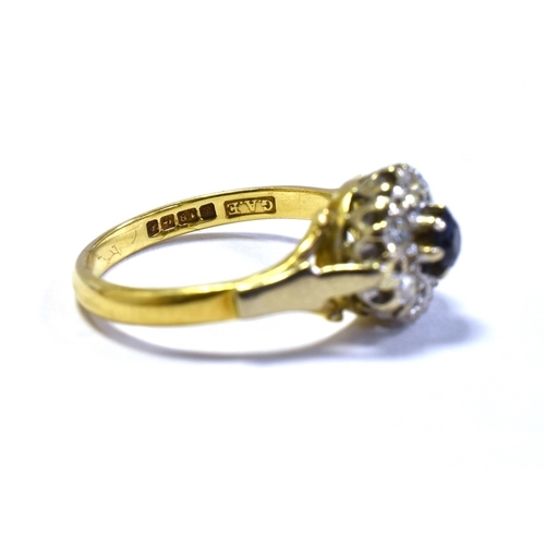 47 - 18CT GOLD SAPPHIRE & DIAMOND RING 9.2mm round cluster head, set with a round sapphire and single cut... 