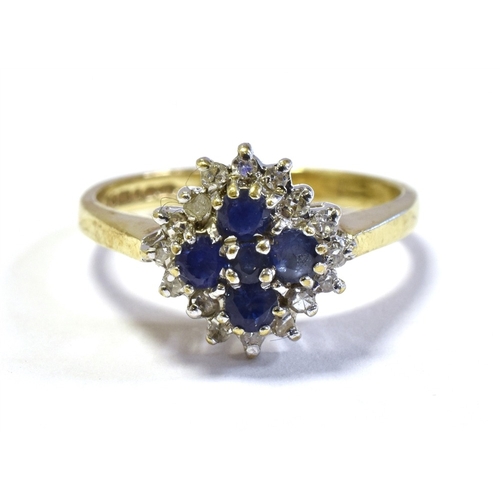 48 - 9CT SAPPHIRE & DIAMOND CLUSTER RING set with five, cornflower blue round sapphires within a surround... 