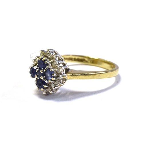 48 - 9CT SAPPHIRE & DIAMOND CLUSTER RING set with five, cornflower blue round sapphires within a surround... 