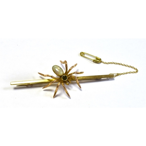 50 - VINTAGE 9CT GOLD GEM SET SPIDER BROOCH 7.6cm long bar, with a central spider motif, set with a very ... 