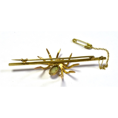 50 - VINTAGE 9CT GOLD GEM SET SPIDER BROOCH 7.6cm long bar, with a central spider motif, set with a very ... 