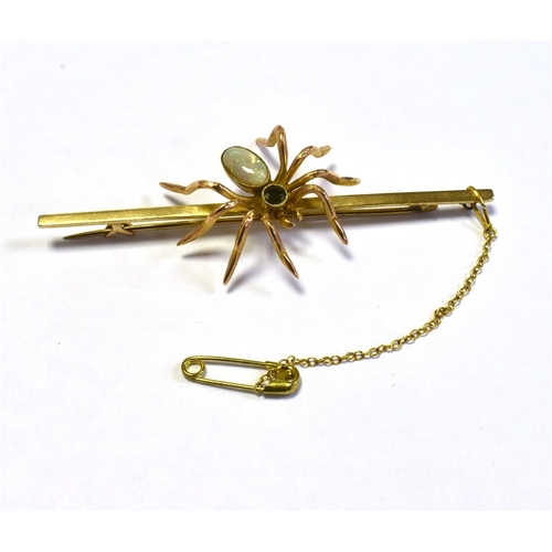 50 - VINTAGE 9CT GOLD GEM SET SPIDER BROOCH 7.6cm long bar, with a central spider motif, set with a very ... 