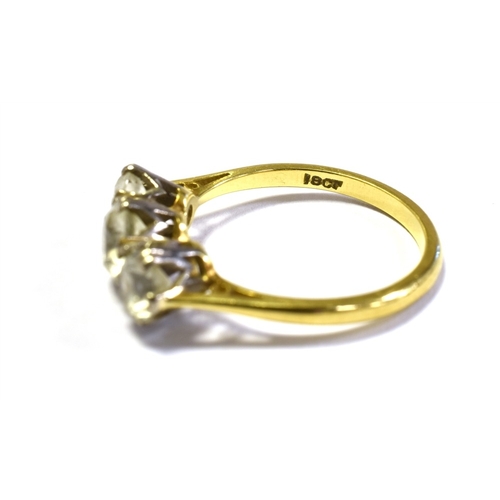 53 - 18CT GOLD THREE STONE RING Three white gold claw settings, containing quartz stones, with a yellow g... 