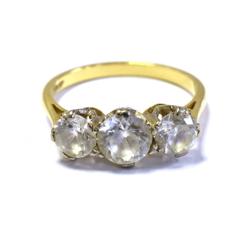 53 - 18CT GOLD THREE STONE RING Three white gold claw settings, containing quartz stones, with a yellow g... 