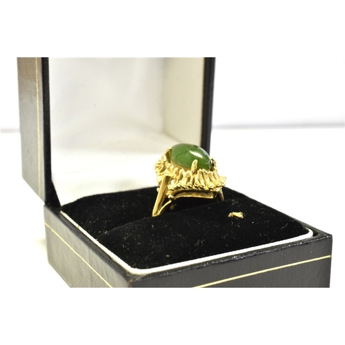 58 - 10CT GOLD & NEPHRITE JADE RING central claw set navette shaped nephrite jade cabochon, within wire w... 