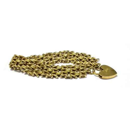 67 - 9CT GOLD FANCY LINK BRACELET 18cm long x 16.5mm wide, secured with a heart shaped padlock, hallmarke... 