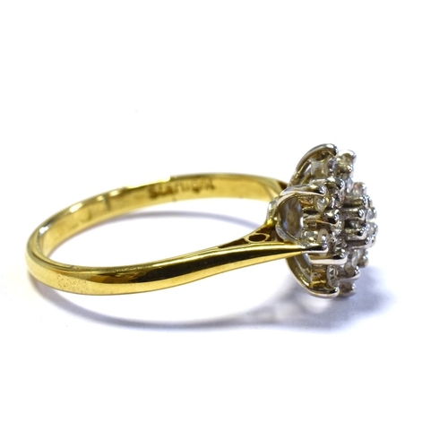 69 - 18CT GOLD & DIAMOND RING with a 10.7mm claw set basket, holding a cluster of single cut and one roun... 