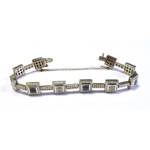 70 - 14CT WHITE GOLD & DIAMOND LINE BRACELET 18cm long, comprising invisibly set square collets within ro... 