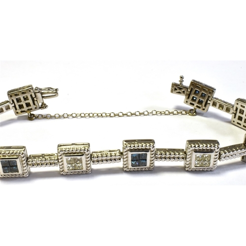 70 - 14CT WHITE GOLD & DIAMOND LINE BRACELET 18cm long, comprising invisibly set square collets within ro... 