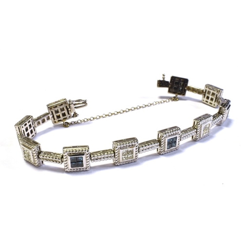 70 - 14CT WHITE GOLD & DIAMOND LINE BRACELET 18cm long, comprising invisibly set square collets within ro... 