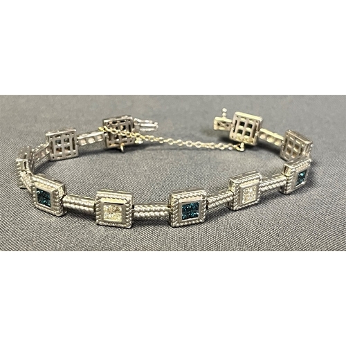 70 - 14CT WHITE GOLD & DIAMOND LINE BRACELET 18cm long, comprising invisibly set square collets within ro... 