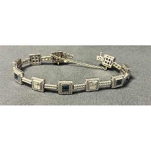 70 - 14CT WHITE GOLD & DIAMOND LINE BRACELET 18cm long, comprising invisibly set square collets within ro... 