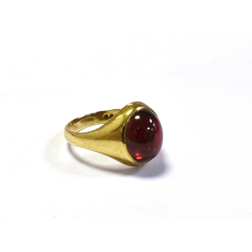 74 - 9CT GOLD SYNTHETIC RUBY RING a bezel set oval cabochon cut synthetic ruby, within integral shank, ha... 