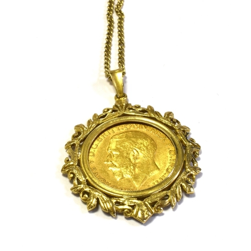 76 - SOVEREIGN COIN PENDANT ON 9CT GOLD CHAIN the sovereign dated 1911, spectacle set in an intricate scr... 