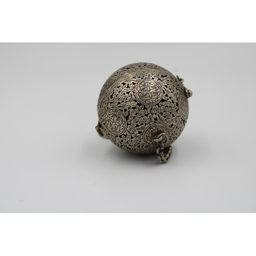 57 - Antique Islamic white metal spinning globe, adorned with owl and floral motifs. Complete with a chai... 