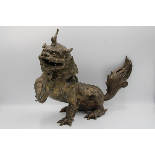 60 - 18th-century Chinese bronze Buddhist lion featuring intricate craftsmanship. Remarkably detailed wit... 