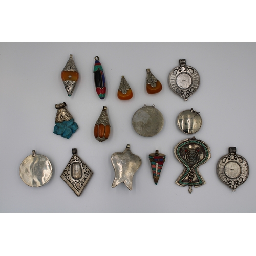 250 - Assorted collection of Tibetan/Nepali pendants crafted from white and yellow metals.  

15x