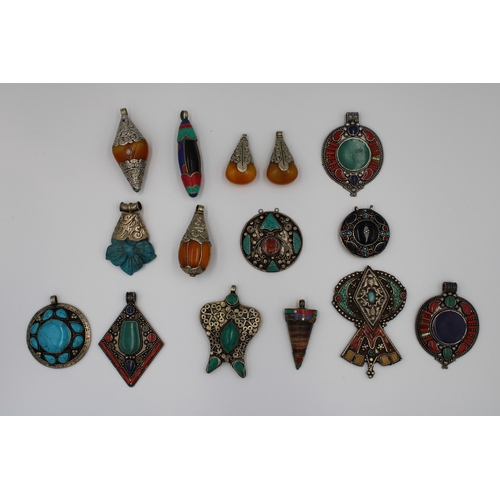 250 - Assorted collection of Tibetan/Nepali pendants crafted from white and yellow metals.  

15x