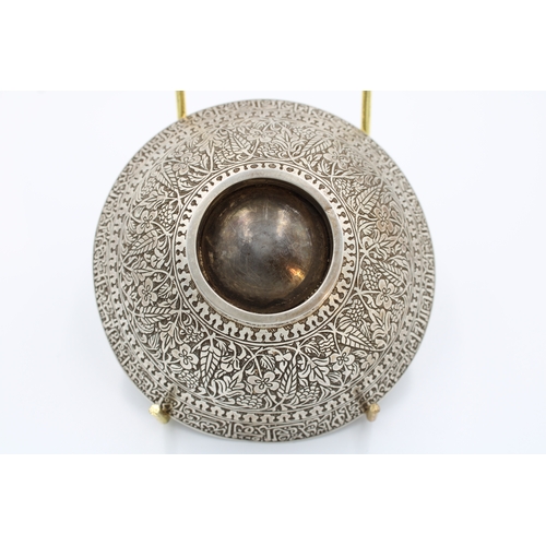 95 - Elegance in Silver: A remarkable Islamic bowl, graced with intricate Arabic inscriptions, expertly f... 