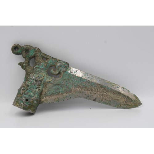 66 - Shang Bronze dagger with dragon and phoenix decoration.

Around 25.5cm long