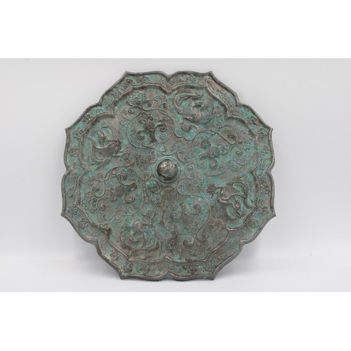 67 - One Tang style bronze mirror with phoenix and plant decorations.

Width around 22cm