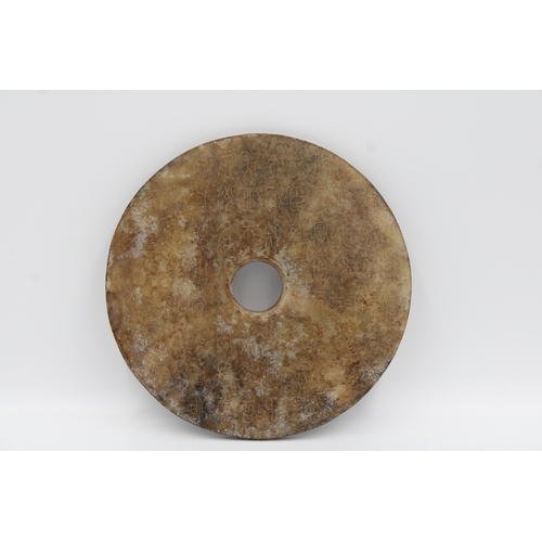 75 - Chinese bi jade disc decorated with symbols.

Diameter around 14.3cm.