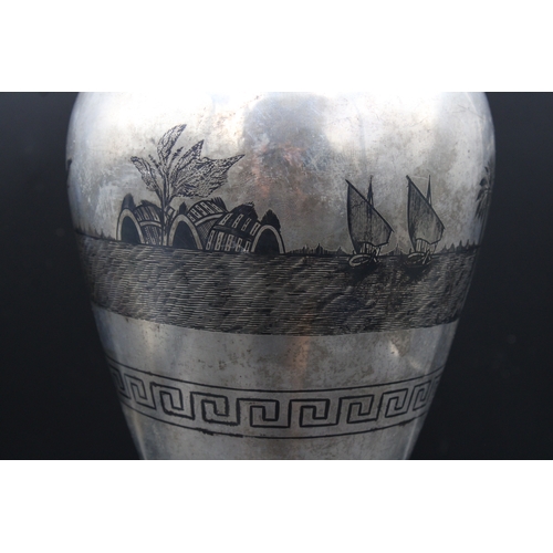 86 - This is an exceptionally large Iraqi silver niello vase adorned with intricate decorations depicting... 