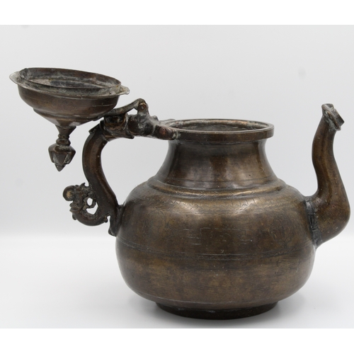 88 - 19th Century Indian Mughal Bronze Teapot with Intricate Carvings.

Roughly 26cm