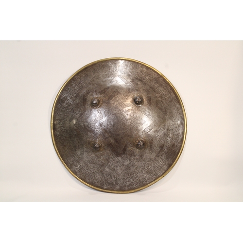 82 - A remarkable 19th-century Indian Islamic shield, crafted from durable steel and adorned with exquisi... 