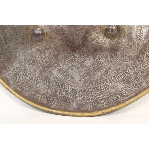 82 - A remarkable 19th-century Indian Islamic shield, crafted from durable steel and adorned with exquisi... 