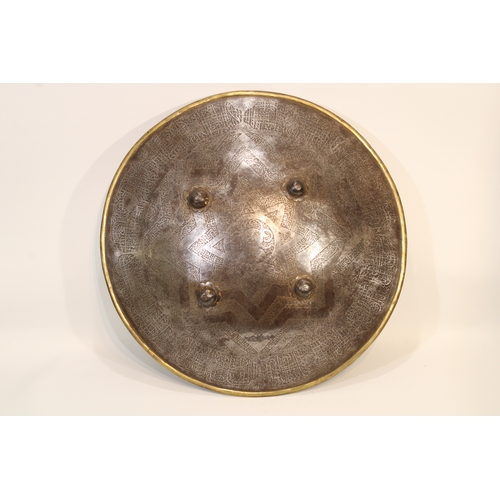 82 - A remarkable 19th-century Indian Islamic shield, crafted from durable steel and adorned with exquisi... 