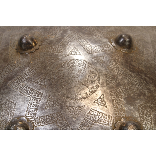 82 - A remarkable 19th-century Indian Islamic shield, crafted from durable steel and adorned with exquisi... 