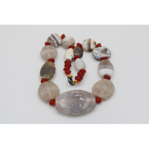 280 - Ancient White and orange agate necklace with a clasp.

Roughly measures 20cm