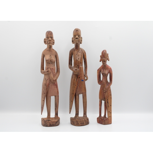 281 - Collection of five African wooden figures.

Tallest figure measures approximately 48.5 cm in length.