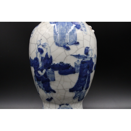 76 - Chinese blue and white crackleware vase, bearing a stamped mark on the base. It stands at a height o... 