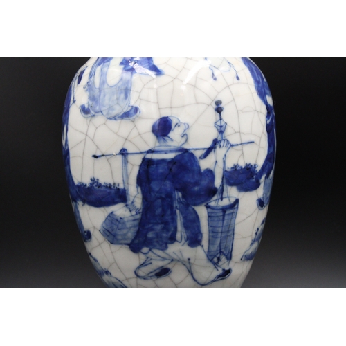 76 - Chinese blue and white crackleware vase, bearing a stamped mark on the base. It stands at a height o... 