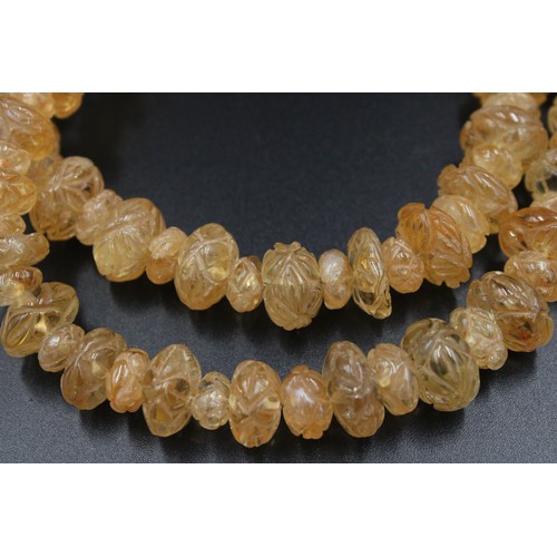 296 - Exquisite crystal necklace adorned with intricate carvings.