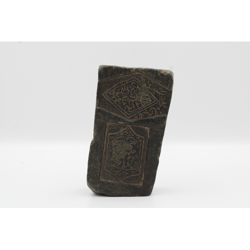 79 - 18th-century Islamic stone with intricate carved calligraphy, a rare piece.

Measuring height of 12c... 