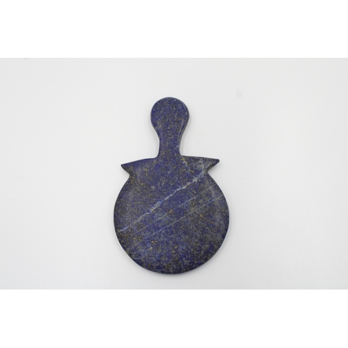 288 - Lapis Lazuli Idol in a unique circular shape. Measuring 8.5cm tall.