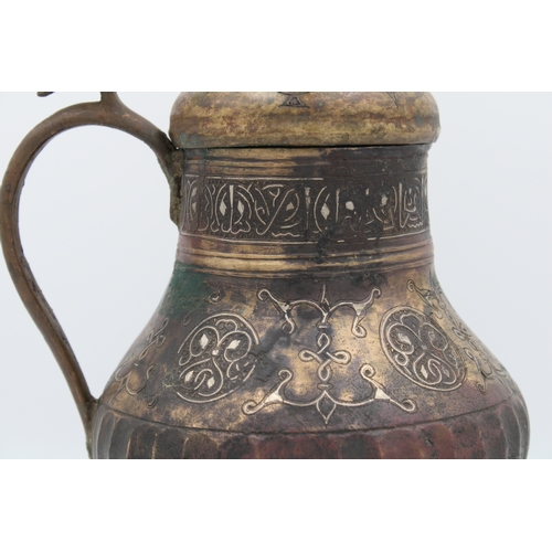 98 - 12th-century Khurasani bronze water jug adorned with Kufic calligraphy. The lid and handle feature i... 