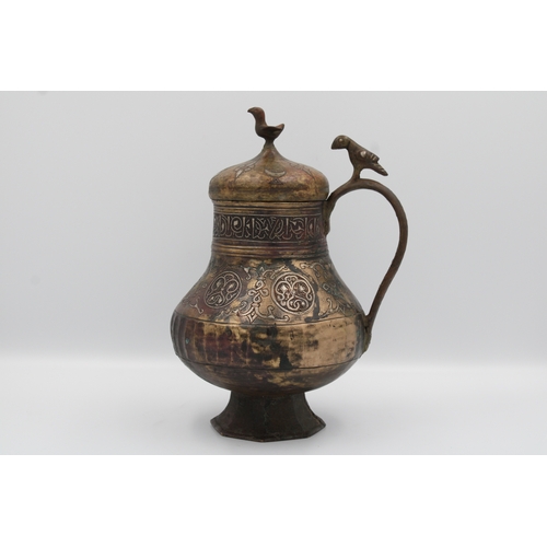 98 - 12th-century Khurasani bronze water jug adorned with Kufic calligraphy. The lid and handle feature i... 