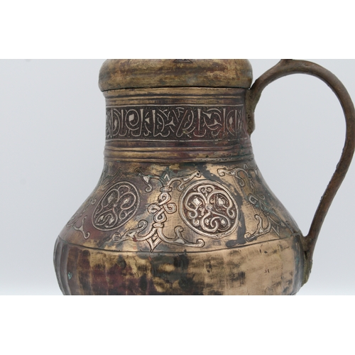 98 - 12th-century Khurasani bronze water jug adorned with Kufic calligraphy. The lid and handle feature i... 