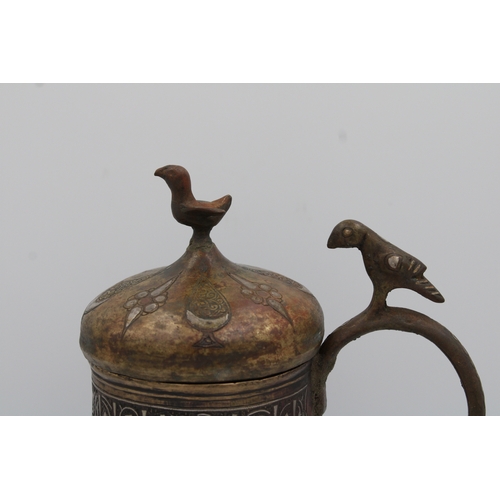 98 - 12th-century Khurasani bronze water jug adorned with Kufic calligraphy. The lid and handle feature i... 