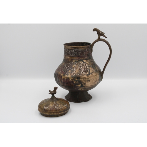 98 - 12th-century Khurasani bronze water jug adorned with Kufic calligraphy. The lid and handle feature i... 