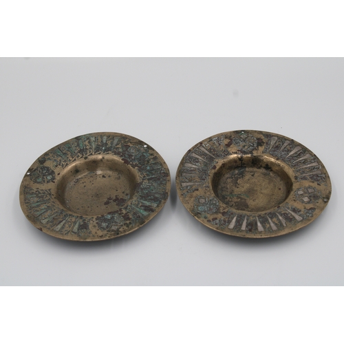 99 - Pair of 11th-century Khurasani bronze weighing scale plates, each measuring 13cm in diameter, adorne... 